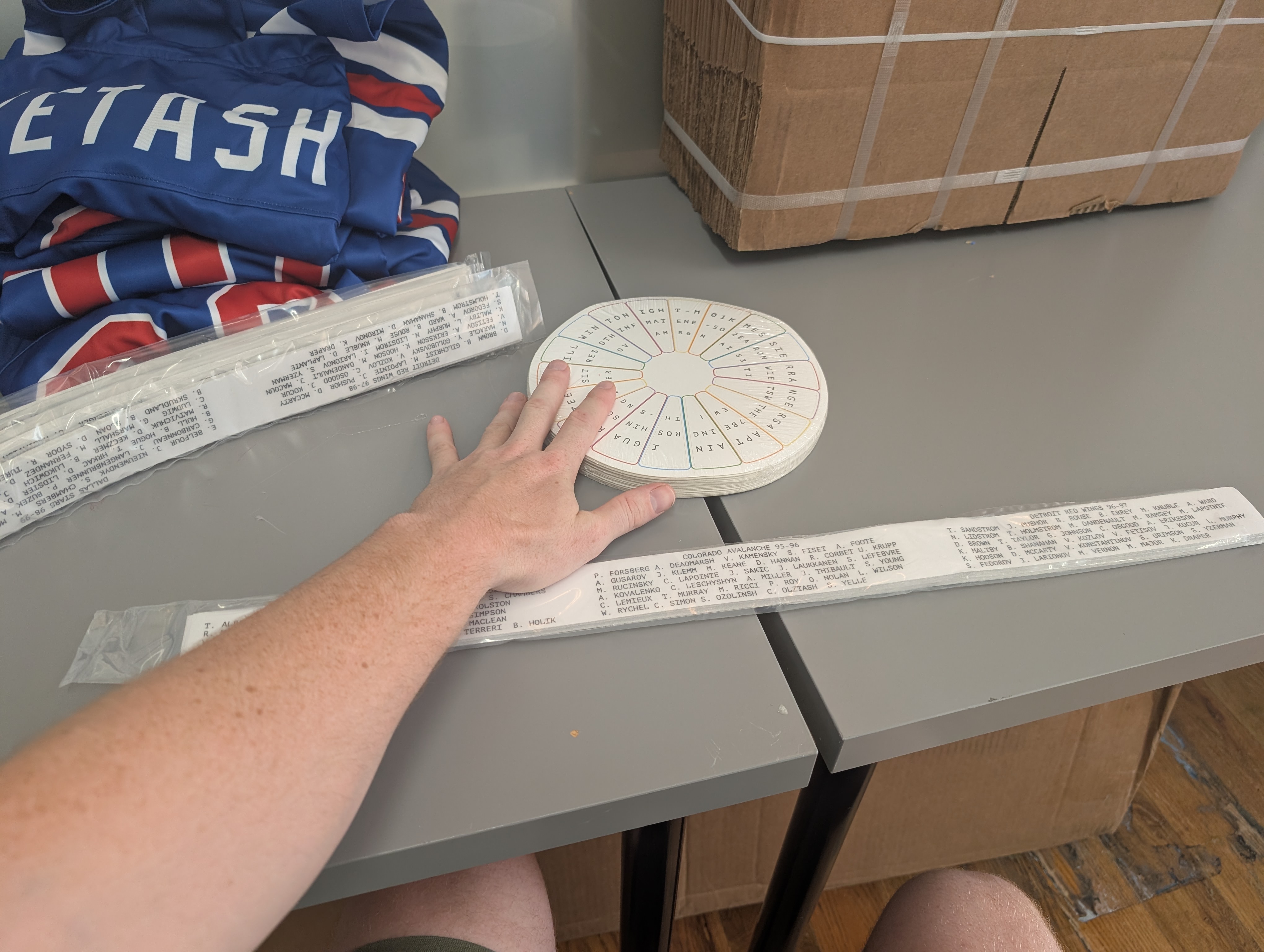 A large pile of unused stickers for the project